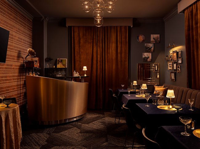 A room with tables and chairs in a private dining in HEW Parlor & Chophouse