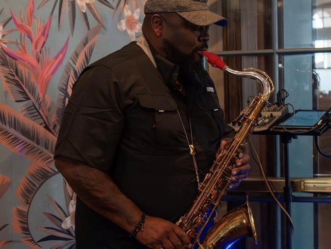 A room with tables and chairs at HEW Parlor & Chophouse in Dunedin FL